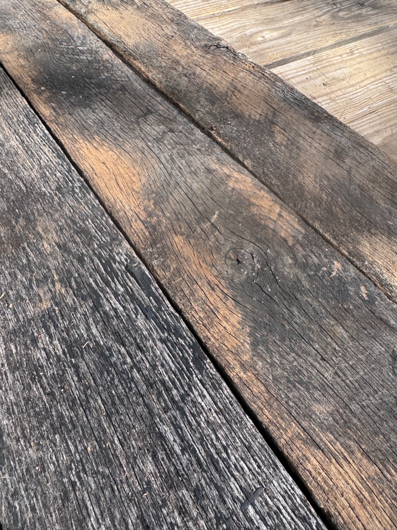 Close-up of reclaimed 1-inch hardwood showing tight grain and aged surface variation