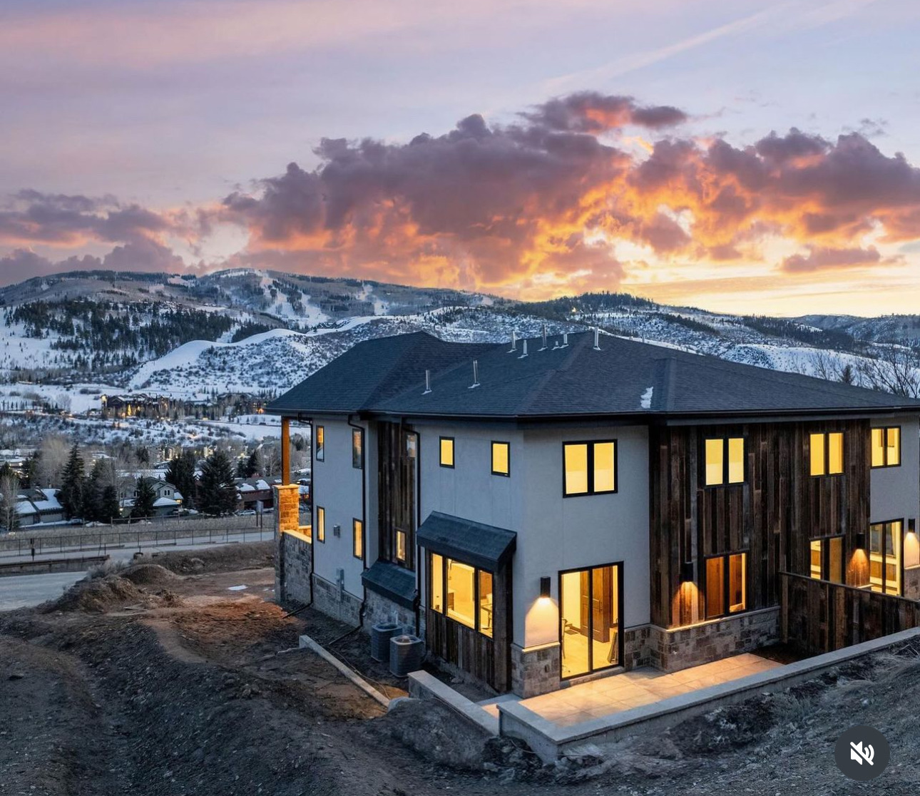Mountain home at sunset clad in reclaimed barn wood siding