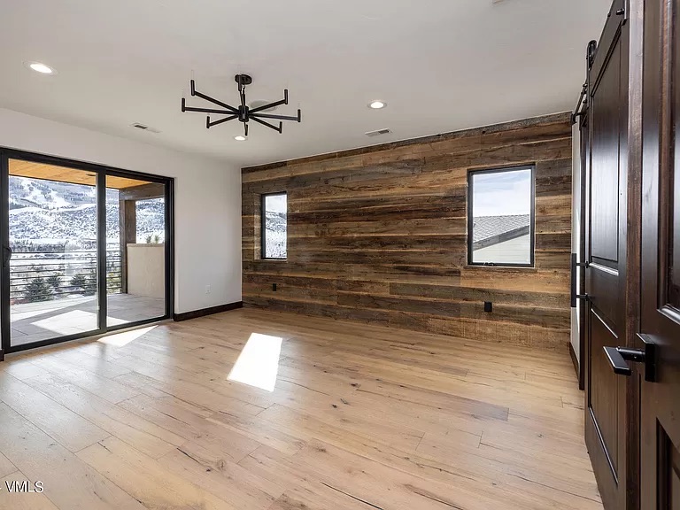 Interior reclaimed wood feature wall with mountain view