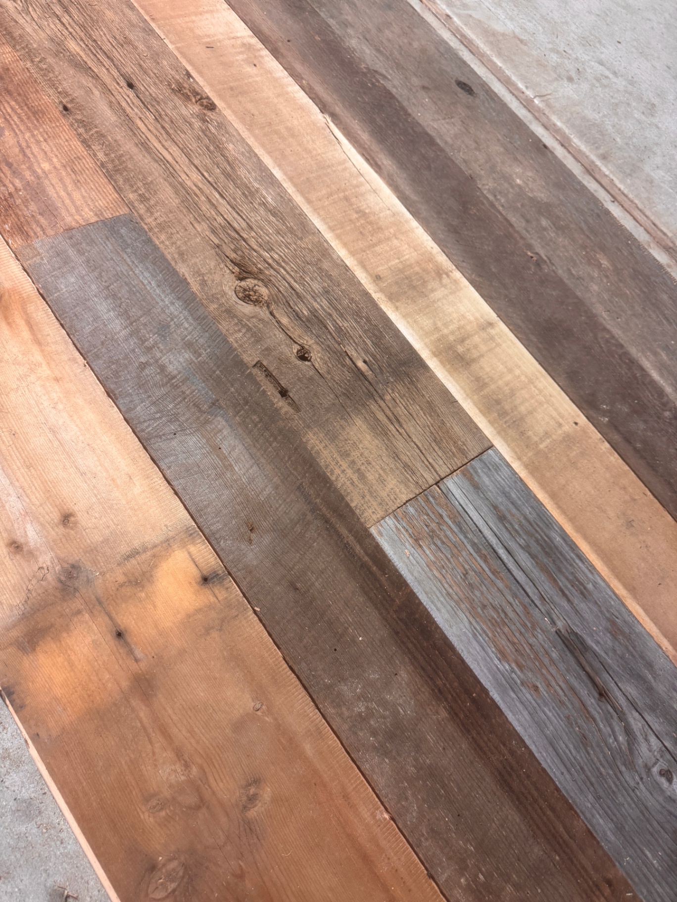 Installed sample area of mixed-tone milled reclaimed boards laid in alternating colors