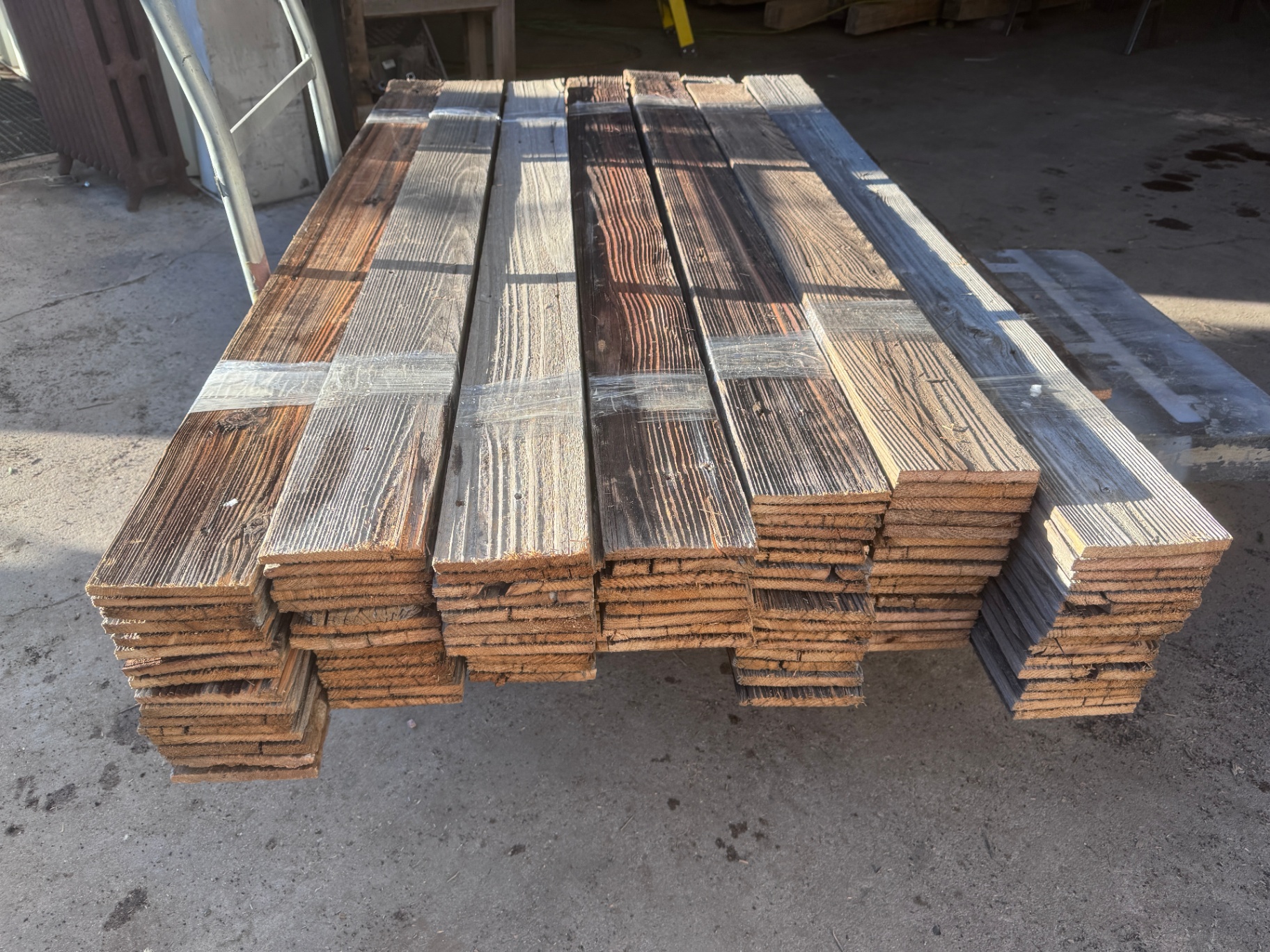 Full bundle of Colorado snow fencing strapped and ready for accent wall installation