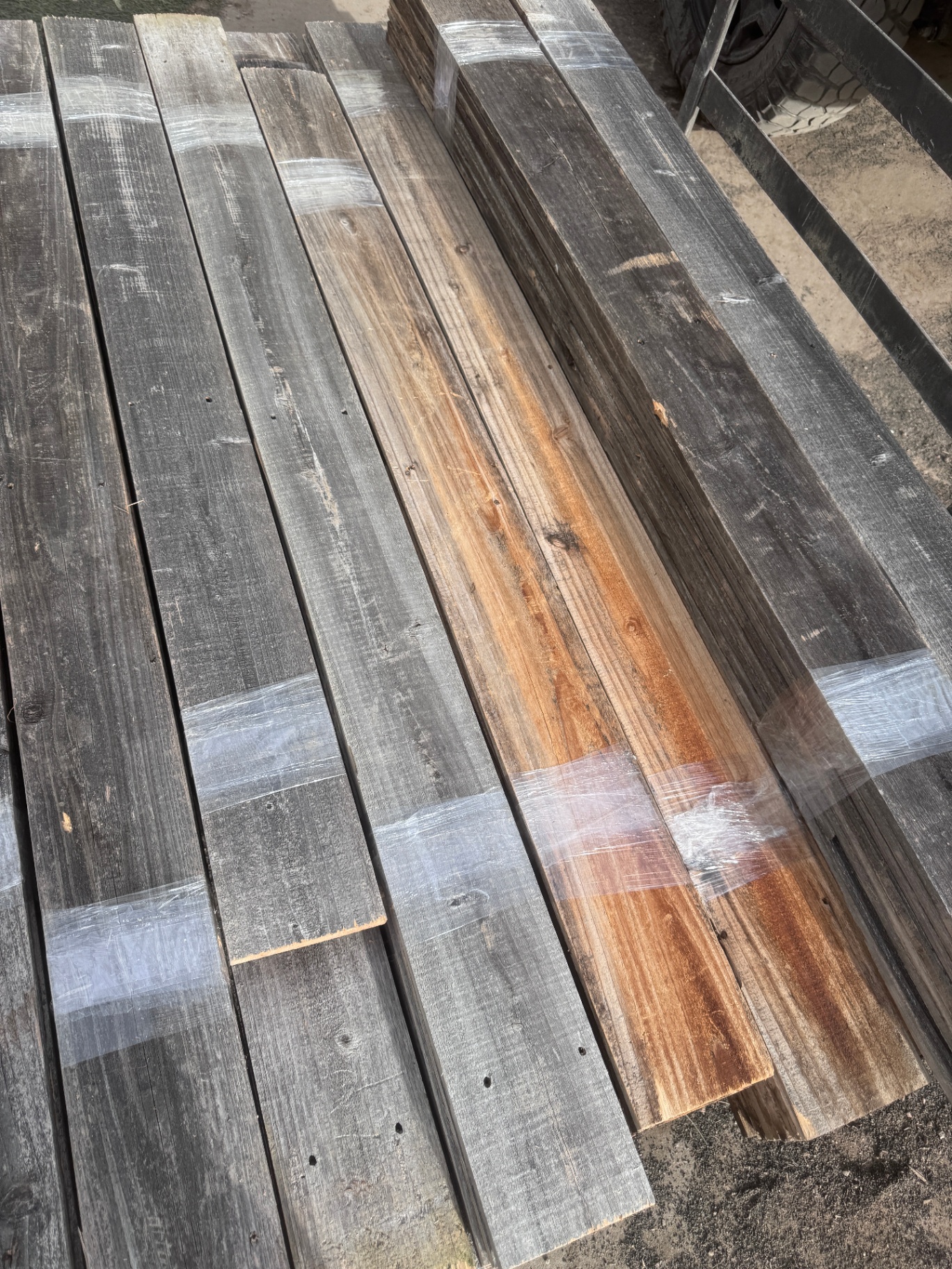 Top-down view of snow fence accent wall bundle with grey and warm tan boards